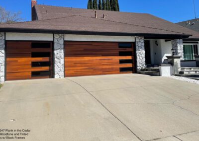 Modern house with stone accents and sleek garage doors